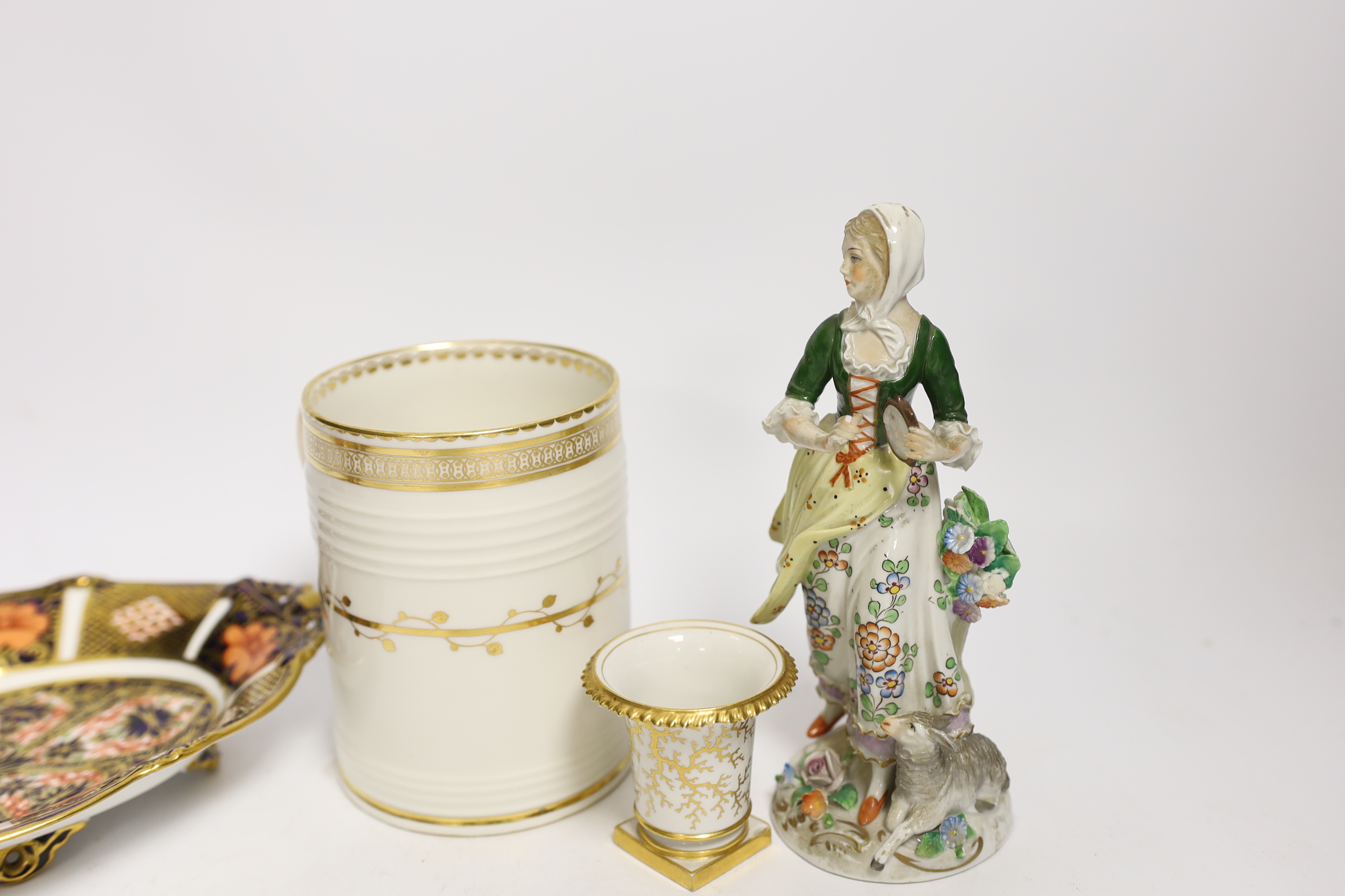 Four porcelain items - a small Flight Barr & Barr Worcester she’ll painted vase, a Derby mug, a Royal Crown Derby dish and a Sitzendorf figure, 16cm